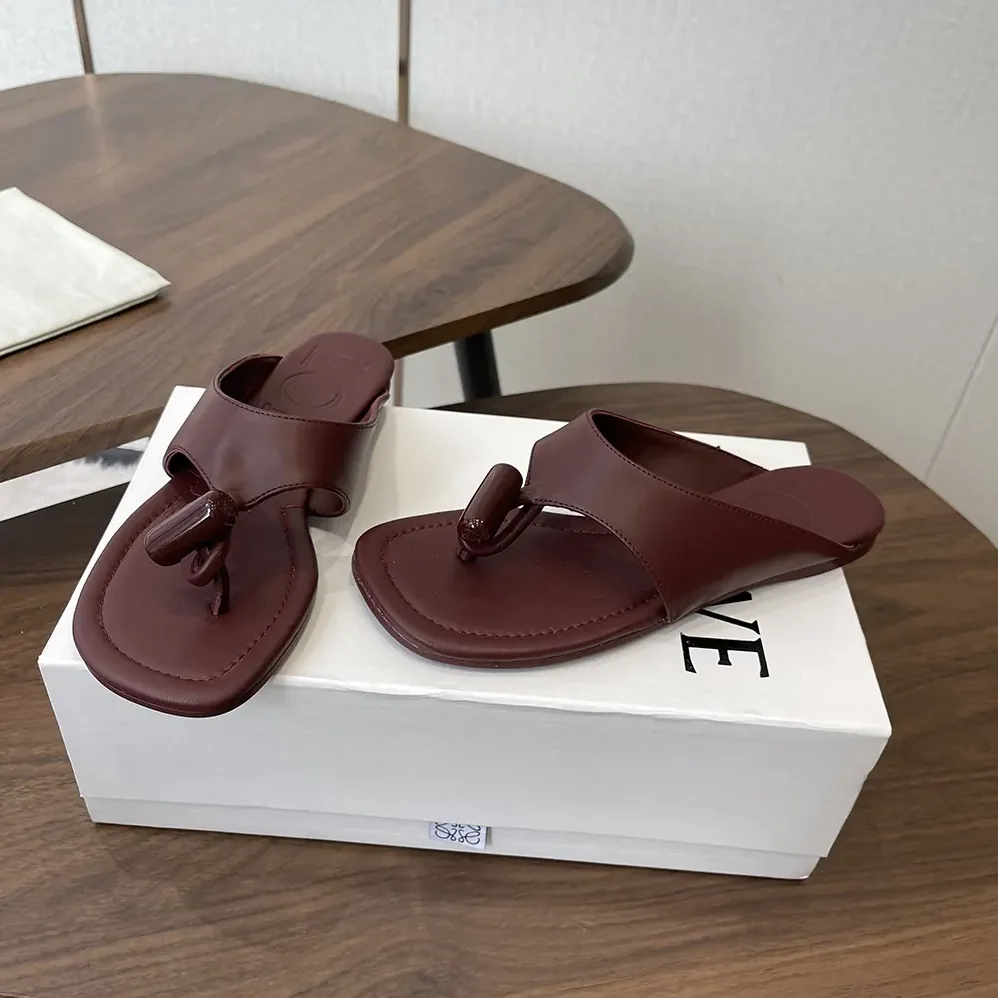Loewe Toggle Flat Sandal in Shiny Smoot Calfskin for Women in Burnt Red Loewe Toggle Flat Sandal in Shiny Smoot Calfskin for Women in Burnt Red