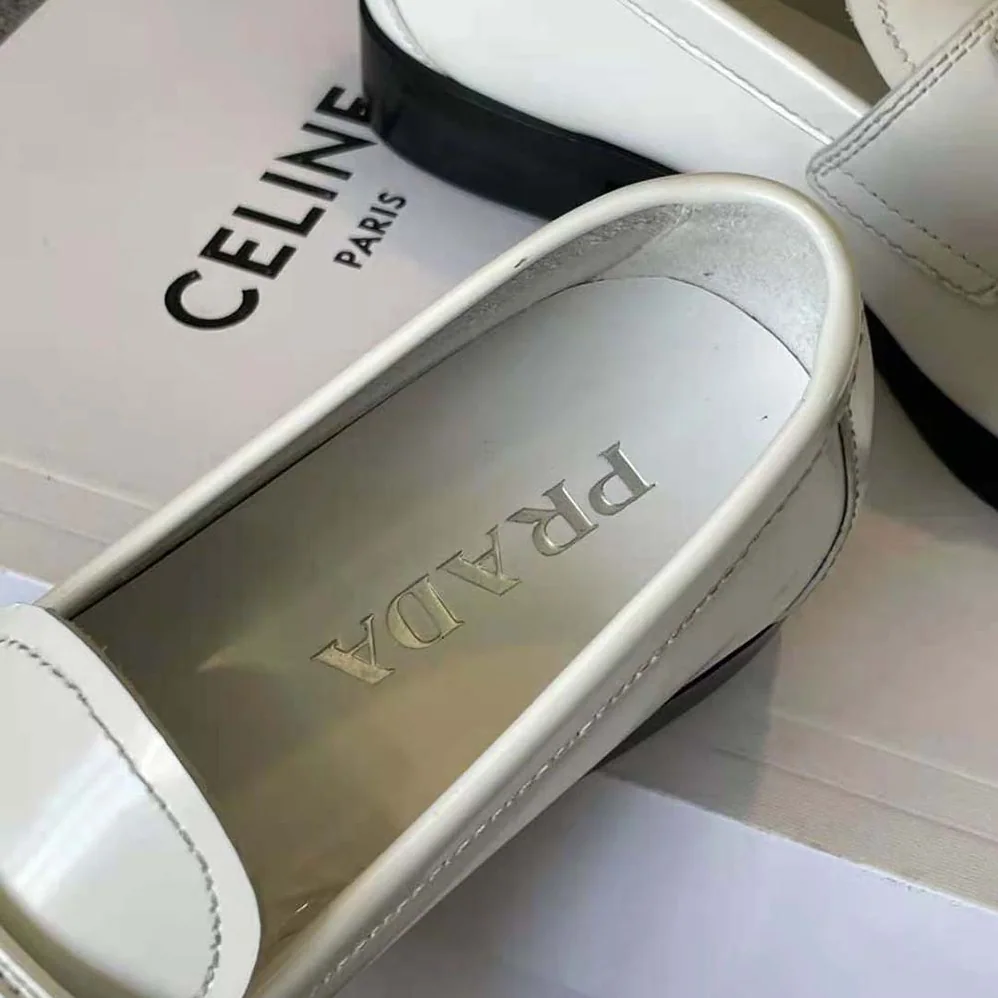Prada Patent Leather Loafers in 25 mm Heel Height for Women in White Prada Patent Leather Loafers in 25 mm Heel Height for Women in White
