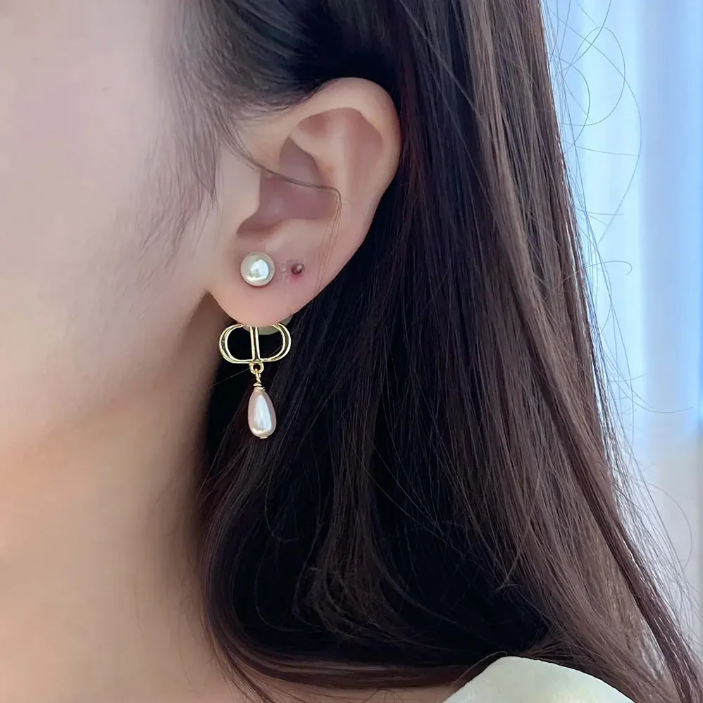 Dior Petit CD Earrings Gold-Finish Metal and Iridescent Pink Resin Pearls for Women Dior Petit CD Earrings Gold-Finish Metal and Iridescent Pink Resin Pearls for Women