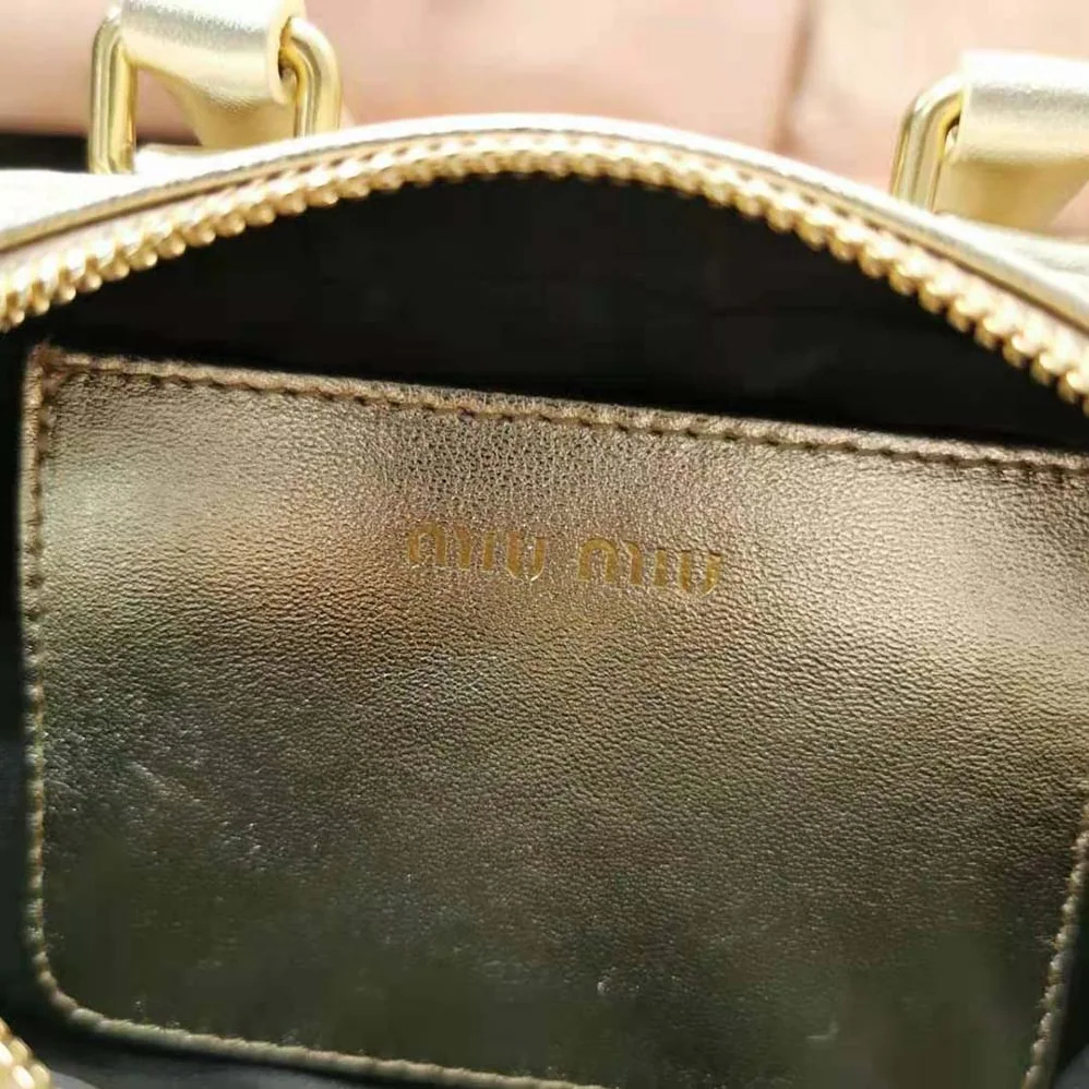 Miu Miu Matelassé Nappa Leather Top-Handle Mini-Bag for Women in Gold