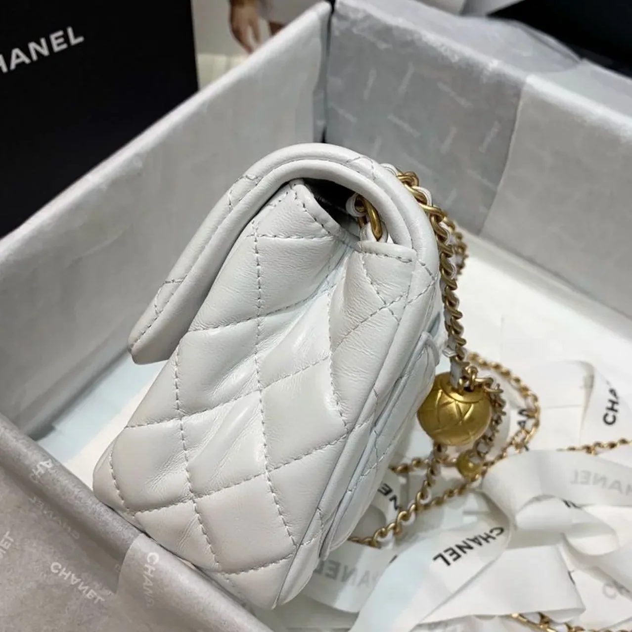 Chanel Flap Bag With CC Ball On Strap Mini Crossbody in White Gold Hardware Chanel Flap Bag With CC Ball On Strap Mini Crossbody in White Gold Hardware