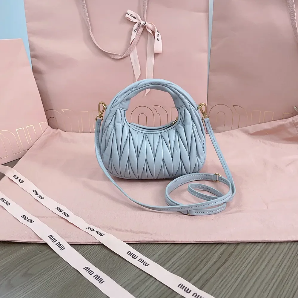Miu Miu Wander Matelassé Nappa Leather Hobo Mini-Bag for Women in Powder Blue Miu Miu Wander Matelassé Nappa Leather Hobo Mini-Bag for Women in Powder Blue