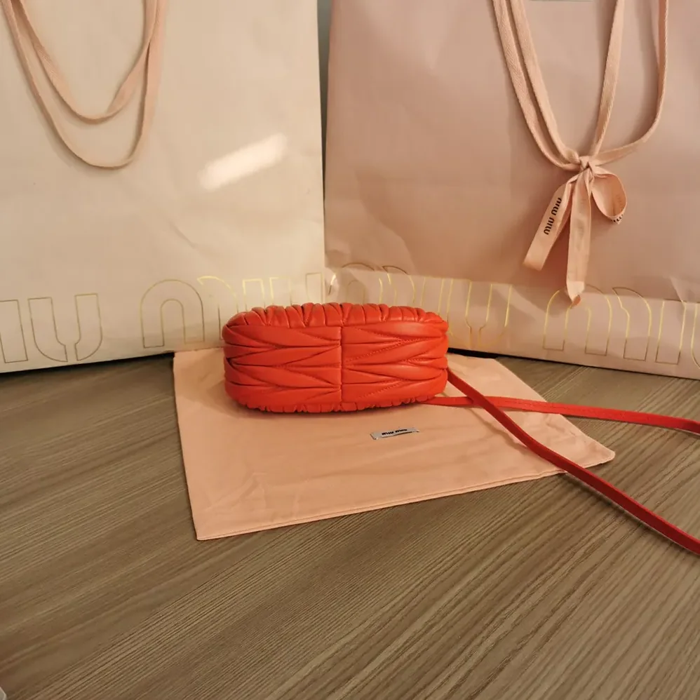 Miu Miu Wander Matelassé Nappa Leather Hobo Mini-Bag for Women in Red Miu Miu Wander Matelassé Nappa Leather Hobo Mini-Bag for Women in Red