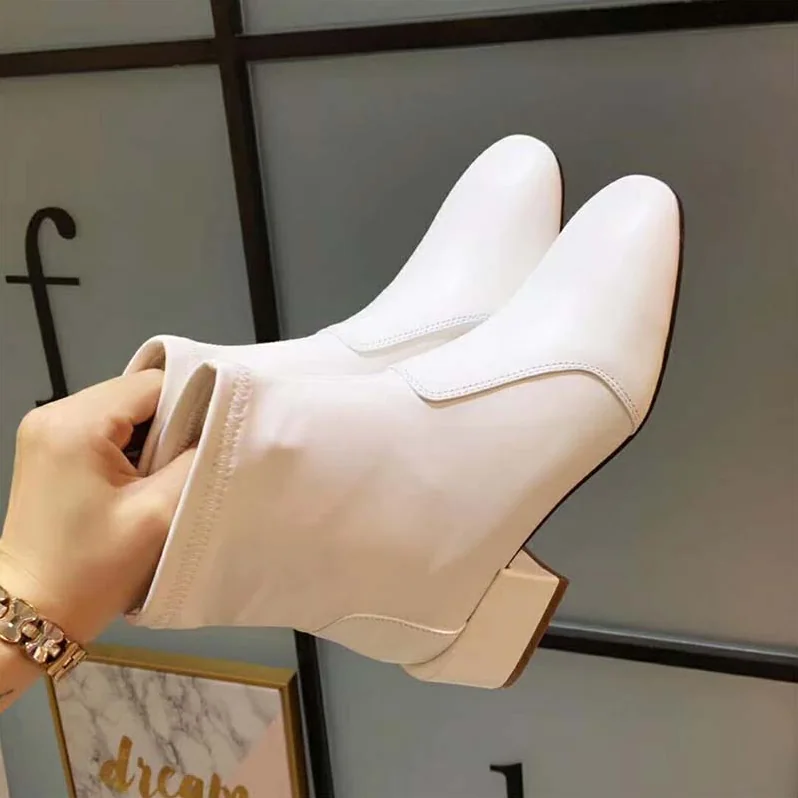 Stuart Weitzman Shoes The Accordion Bootie 40mm Heel for Women in White Stuart Weitzman Shoes The Accordion Bootie 40mm Heel for Women in White