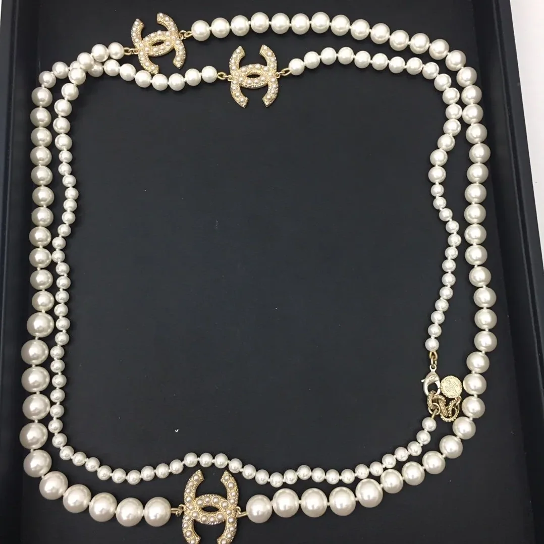 Chanel Three Chanel Iconics Pearl Necklace White Chanel Three Chanel Iconics Pearl Necklace White