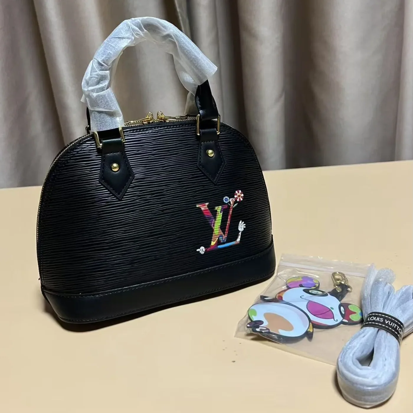 Louis Vuitton LV x TM Alma BB Top Handle Bag in Black Gold Hardware