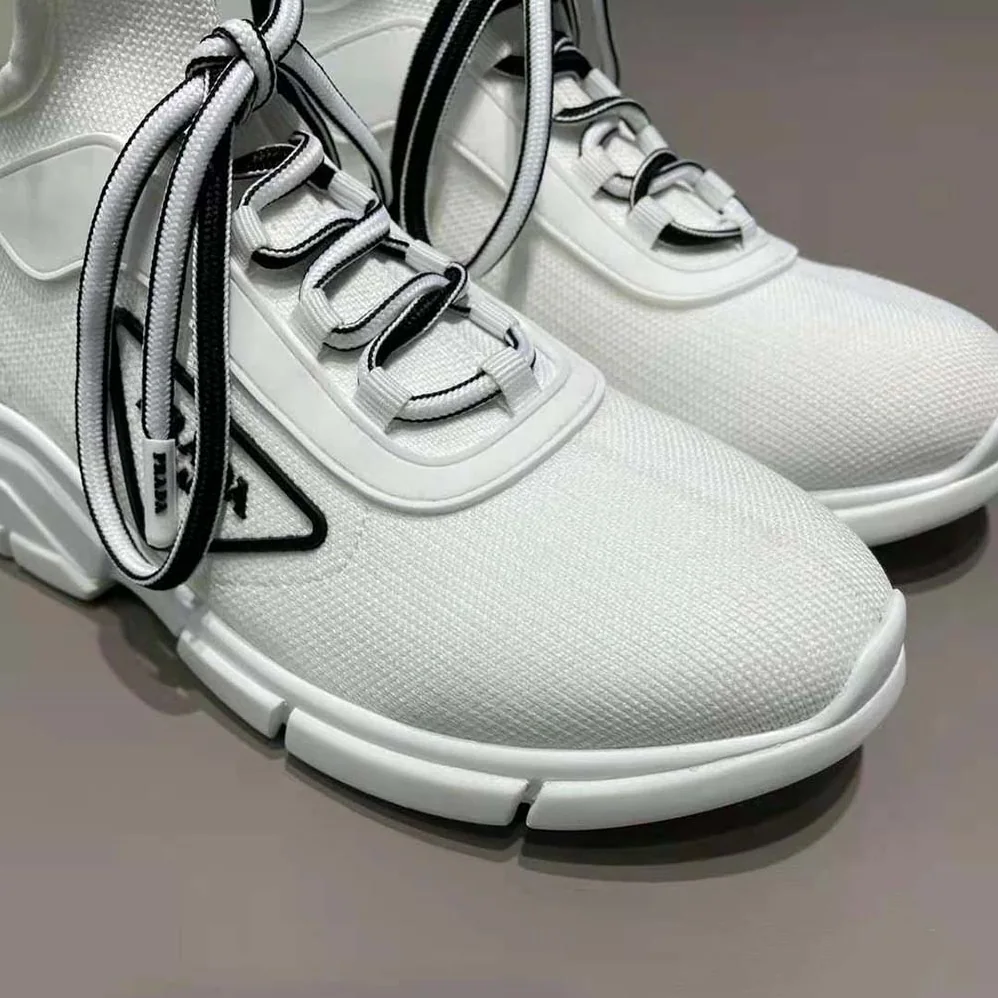 Prada The Triangle Logo Decorates These Knit Fabric Sneakers for Women in White Prada The Triangle Logo Decorates These Knit Fabric Sneakers for Women in White
