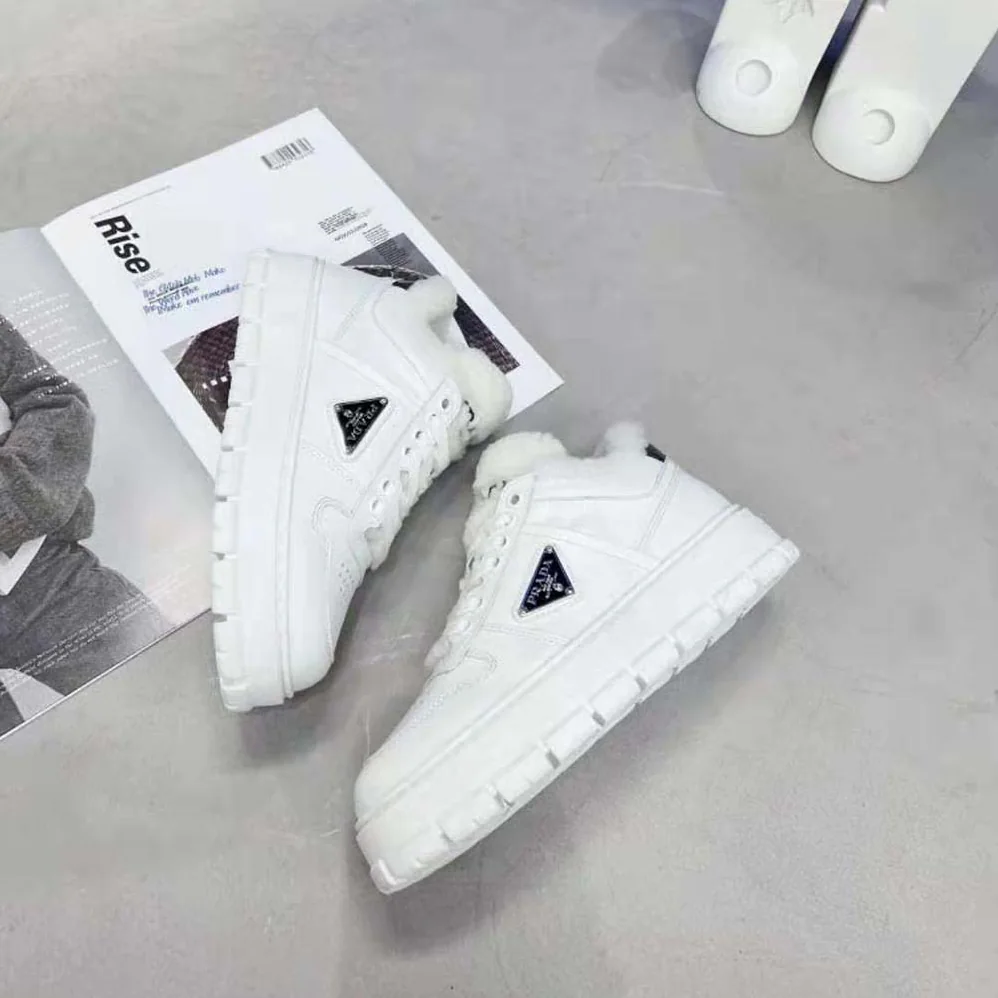 Prada Leather and Shearling Sneakers for Women in White