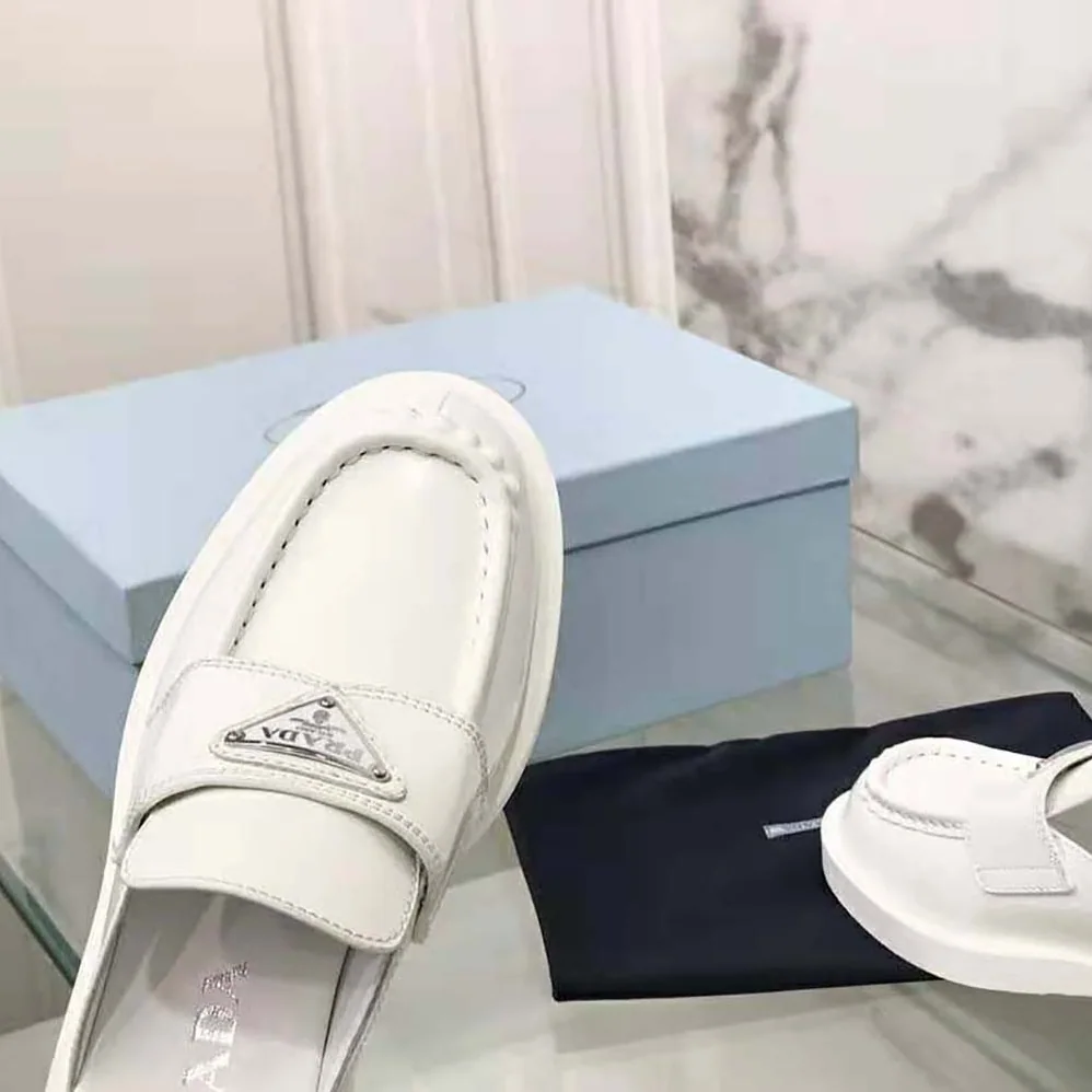 Prada Chocolate Brushed Leather Mules for Women in White Prada Chocolate Brushed Leather Mules for Women in White