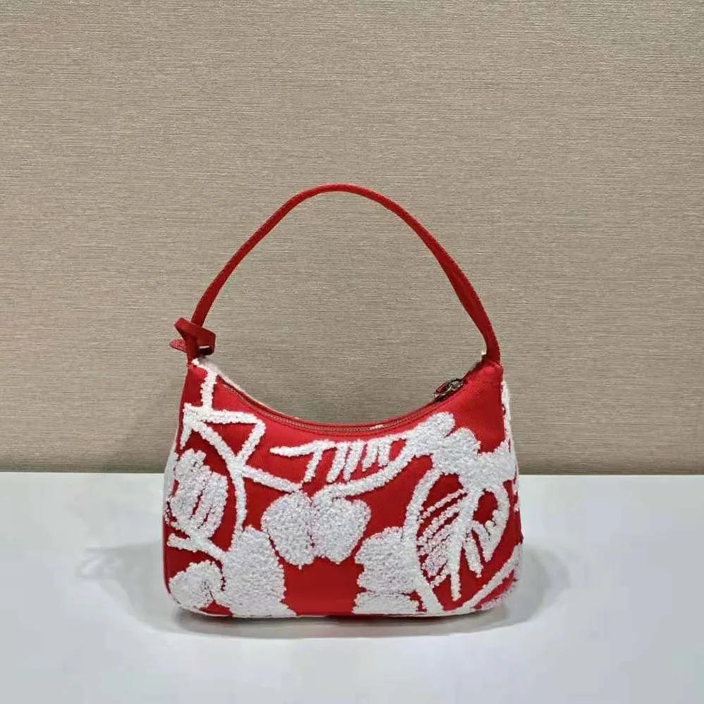 Prada Re-Edition 2006 Embroidered Drill Mini Bag for Women in Red Prada Re-Edition 2006 Embroidered Drill Mini Bag for Women in Red