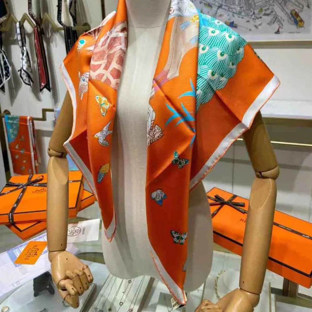 Hermes Hermes Story Scarf 90 in Silk Twill with Hand-Rolled Edges for Women in Orange