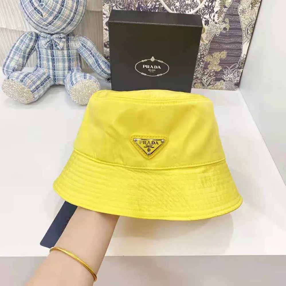 Prada Nylon Bucket Hat Decorated with the Triangle Logo for Women in Yellow
