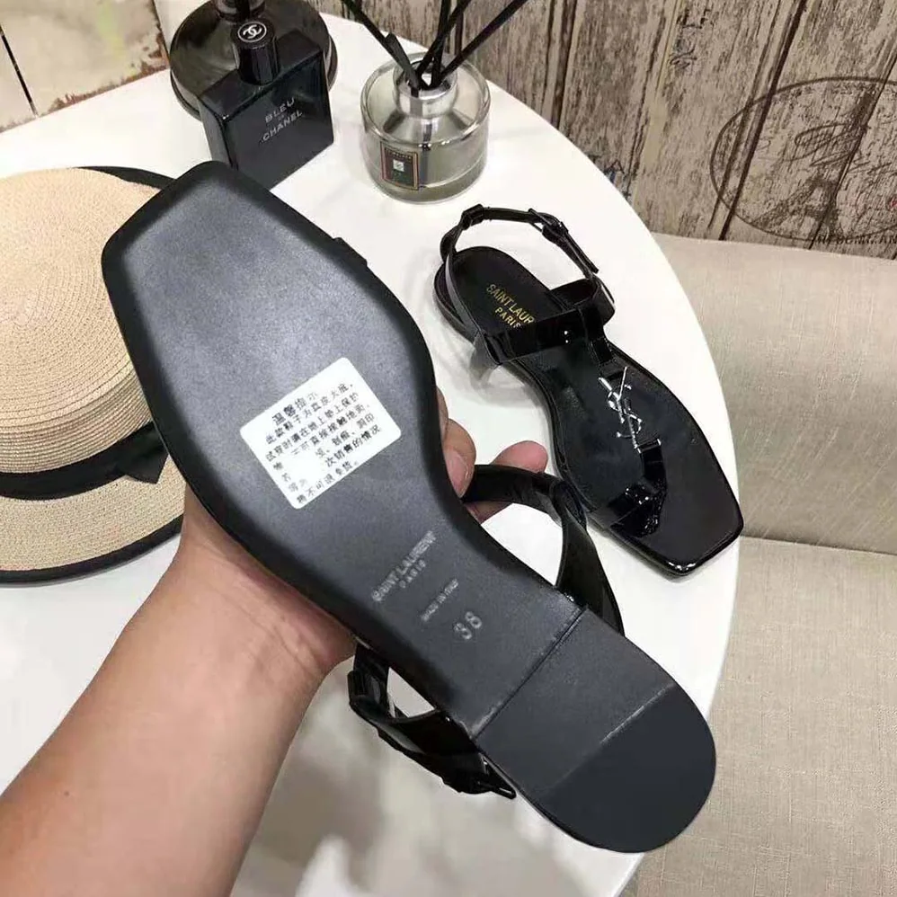 Saint Laurent YSL Cassandra Flat Sandals in Patent Leather with Silver for Women in Tone Monogram