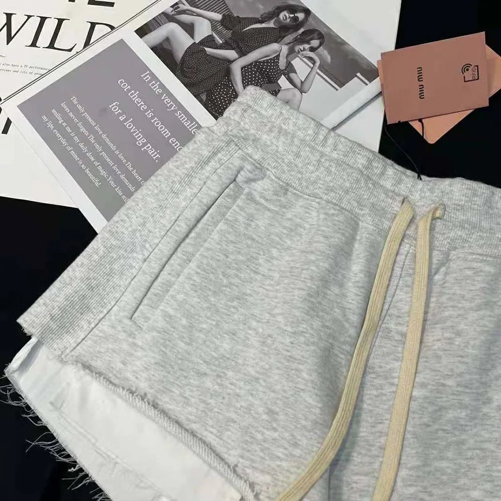 Miu Miu Embroidered Cotton Fleece Shorts for Women in Silver