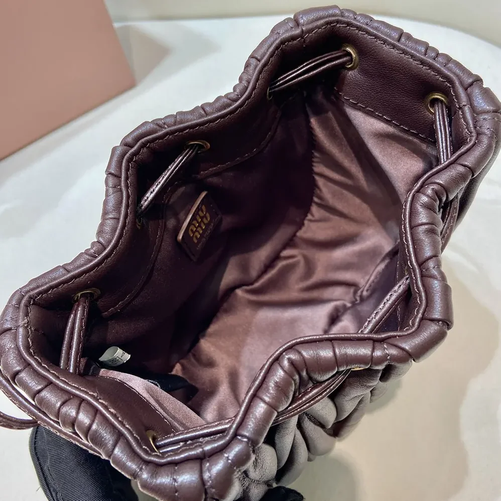 Miu Miu Matelassé Nappa Leather Pouch for Women in Burgundy Miu Miu Matelassé Nappa Leather Pouch for Women in Burgundy