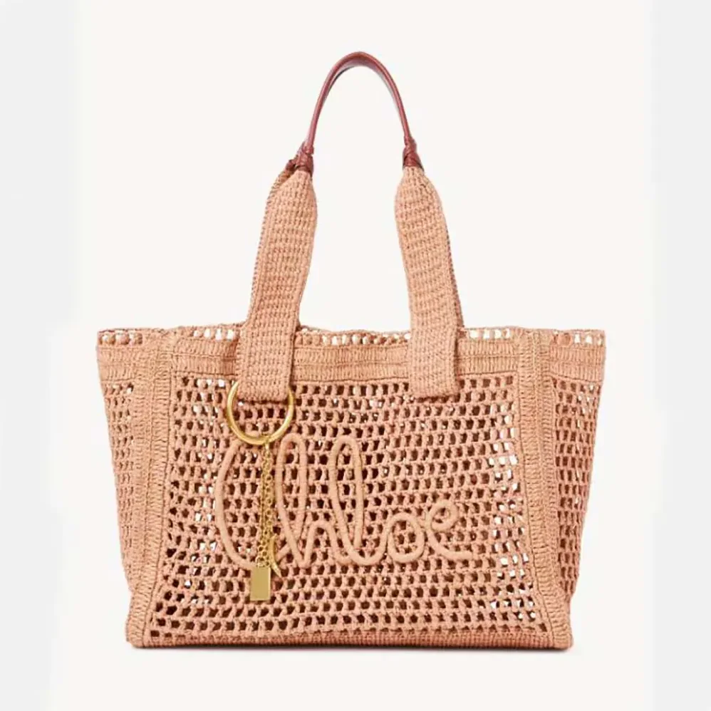 Chloe Summer Banana East-west Tote Bag in Raffia & Buffalo Leather for Women in Pink Chloe Summer Banana East-west Tote Bag in Raffia & Buffalo Leather for Women in Pink