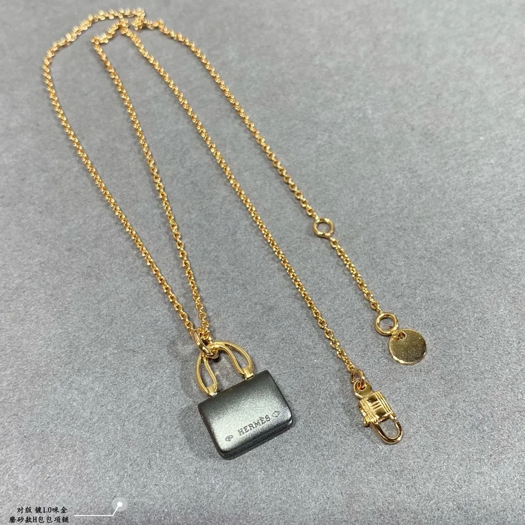 Hermes Constance Amulets Pendant Necklace Gold Tone Hermes Constance Amulets Pendant Necklace Gold Tone