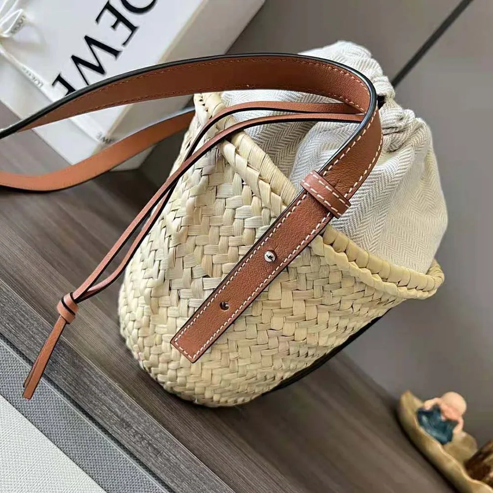 Loewe Drawstring Bucket Bag in Palm Leaf and Calfskin for Women in Brown Loewe Drawstring Bucket Bag in Palm Leaf and Calfskin for Women in Brown