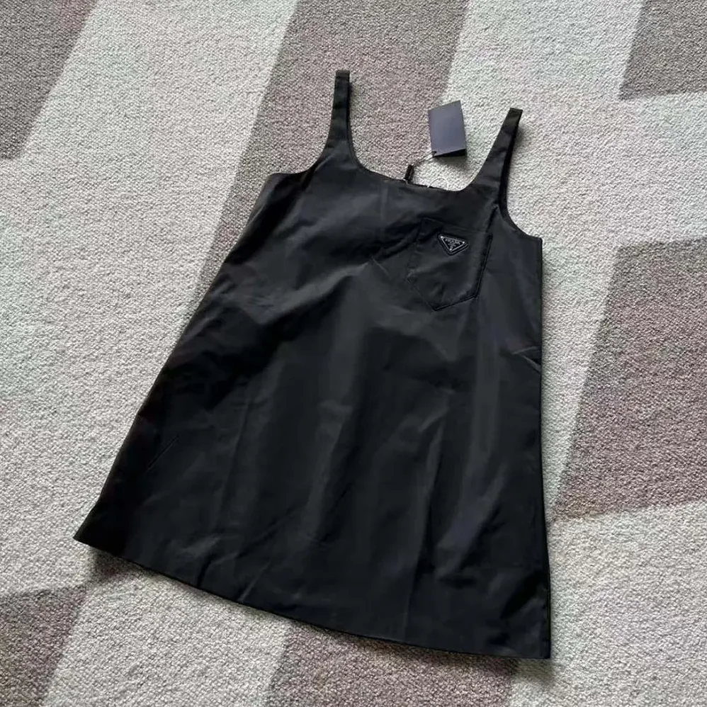 Prada Re-Nylon Mini-dress with Metal Triangle Logo for Women in Black Prada Re-Nylon Mini-dress with Metal Triangle Logo for Women in Black
