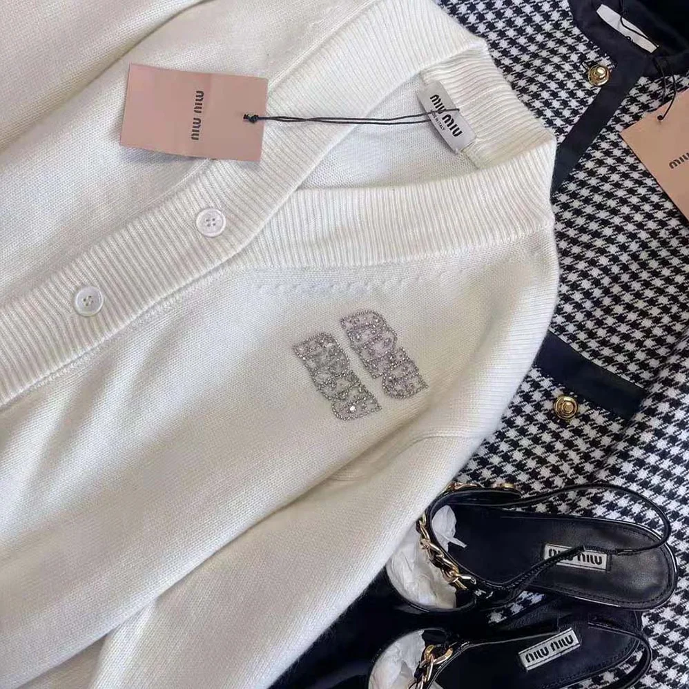 Miu Miu Cashmere Cardigan Features an Embroidered Logo for Women in White Miu Miu Cashmere Cardigan Features an Embroidered Logo for Women in White