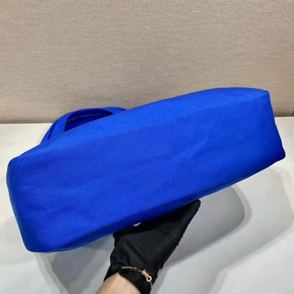 Prada Canvas Hobo Bag with Embossed Logo on the Front for Men in Blue Prada Canvas Hobo Bag with Embossed Logo on the Front for Men in Blue