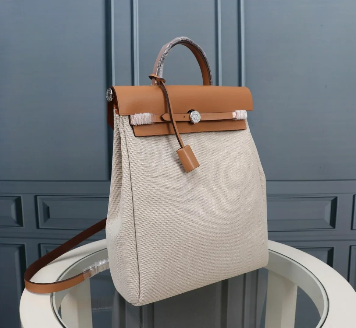 Hermes Buckle Lock Shape Striped Beige, Silver Toned Hardware Bag