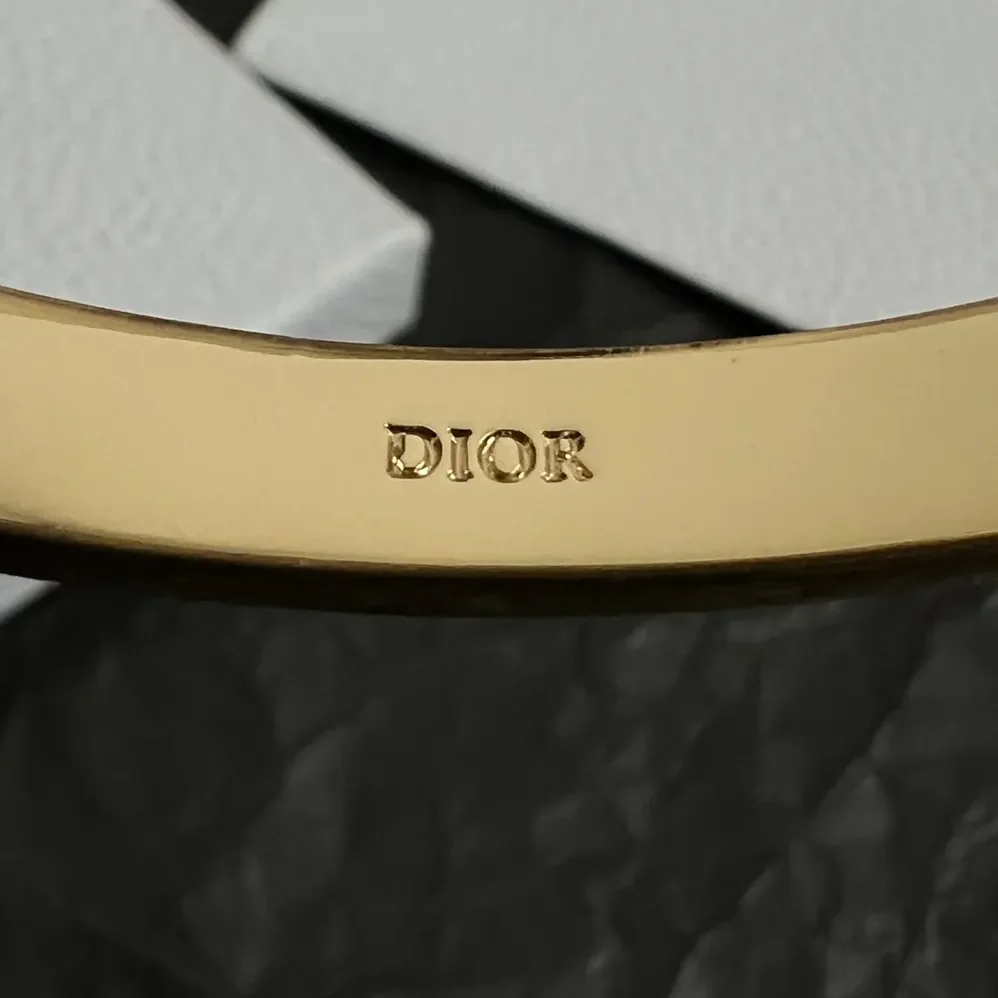 Dior Night Code Bangle Gold-Finish Metal White Crystals and Black Lacquer for Women Dior Night Code Bangle Gold-Finish Metal White Crystals and Black Lacquer for Women