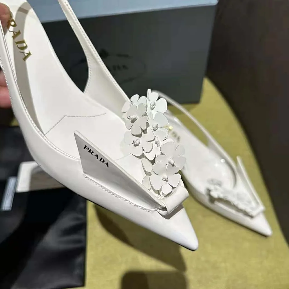 Prada Brushed Leather Slingback Pumps with Floral Appliques for Women in White Prada Brushed Leather Slingback Pumps with Floral Appliques for Women in White