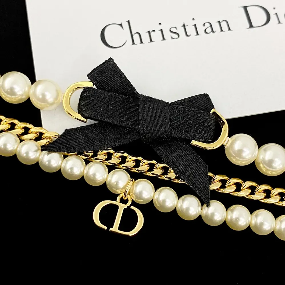 Dior Le Nœud de Dior Bracelet Gold-Finish Metal with White Resin Pearls and Black Satin for Women Dior Le Nœud de Dior Bracelet Gold-Finish Metal with White Resin Pearls and Black Satin for Women