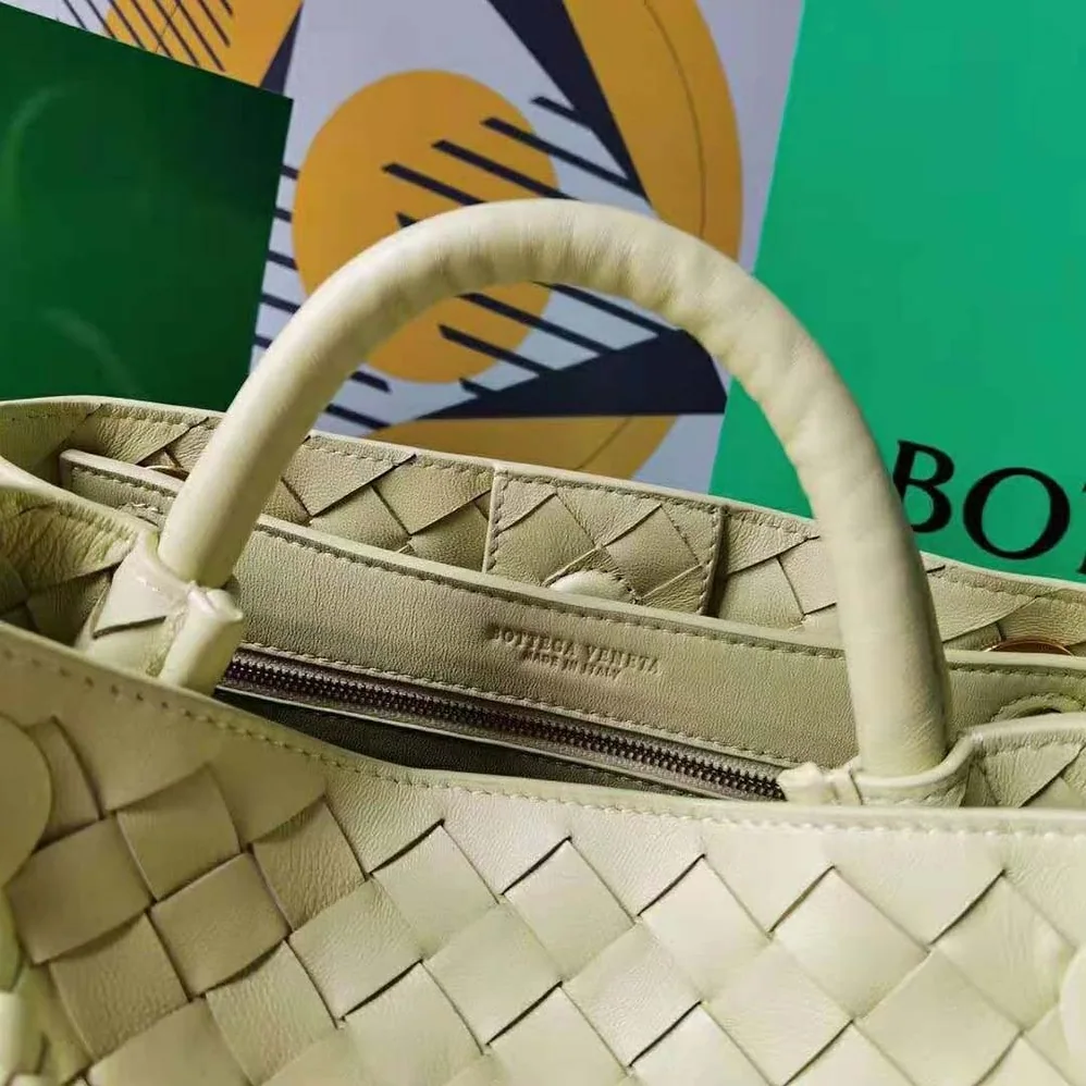Bottega Veneta Small Andiamo Intrecciato Leather Top Handle Bag for Women in Yellow