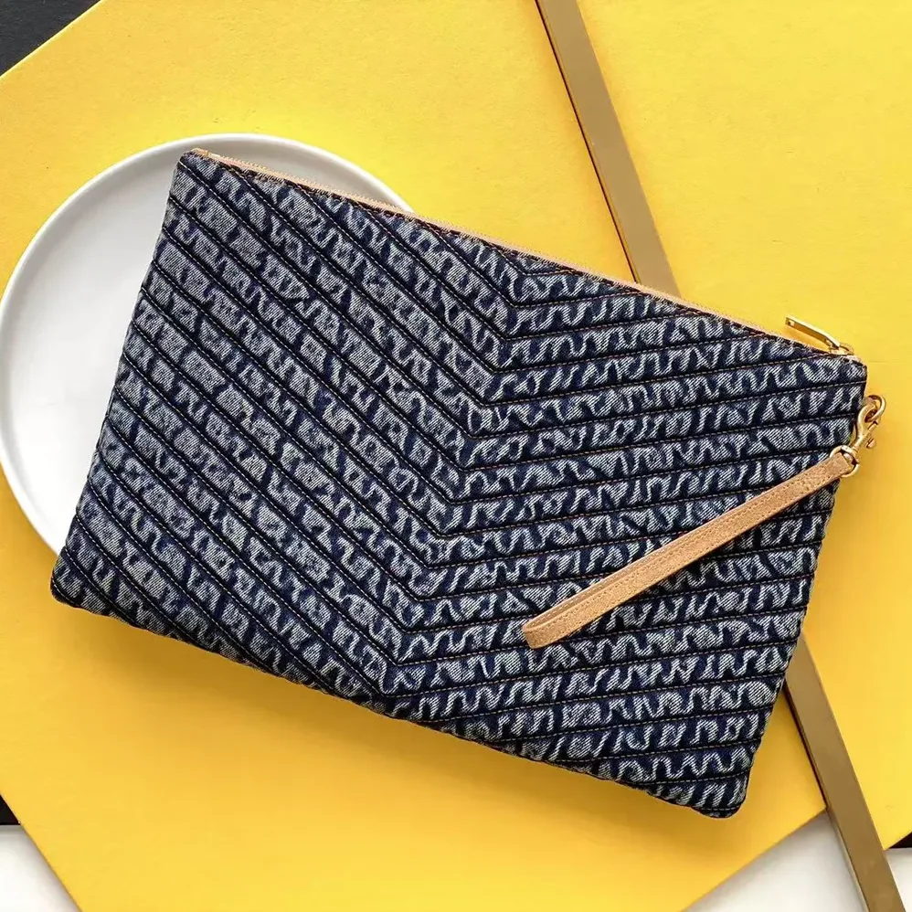 Saint Laurent YSL Monogram Tablet Pouch in Quilted Vintage Denim and Suede for Women Saint Laurent YSL Monogram Tablet Pouch in Quilted Vintage Denim and Suede for Women