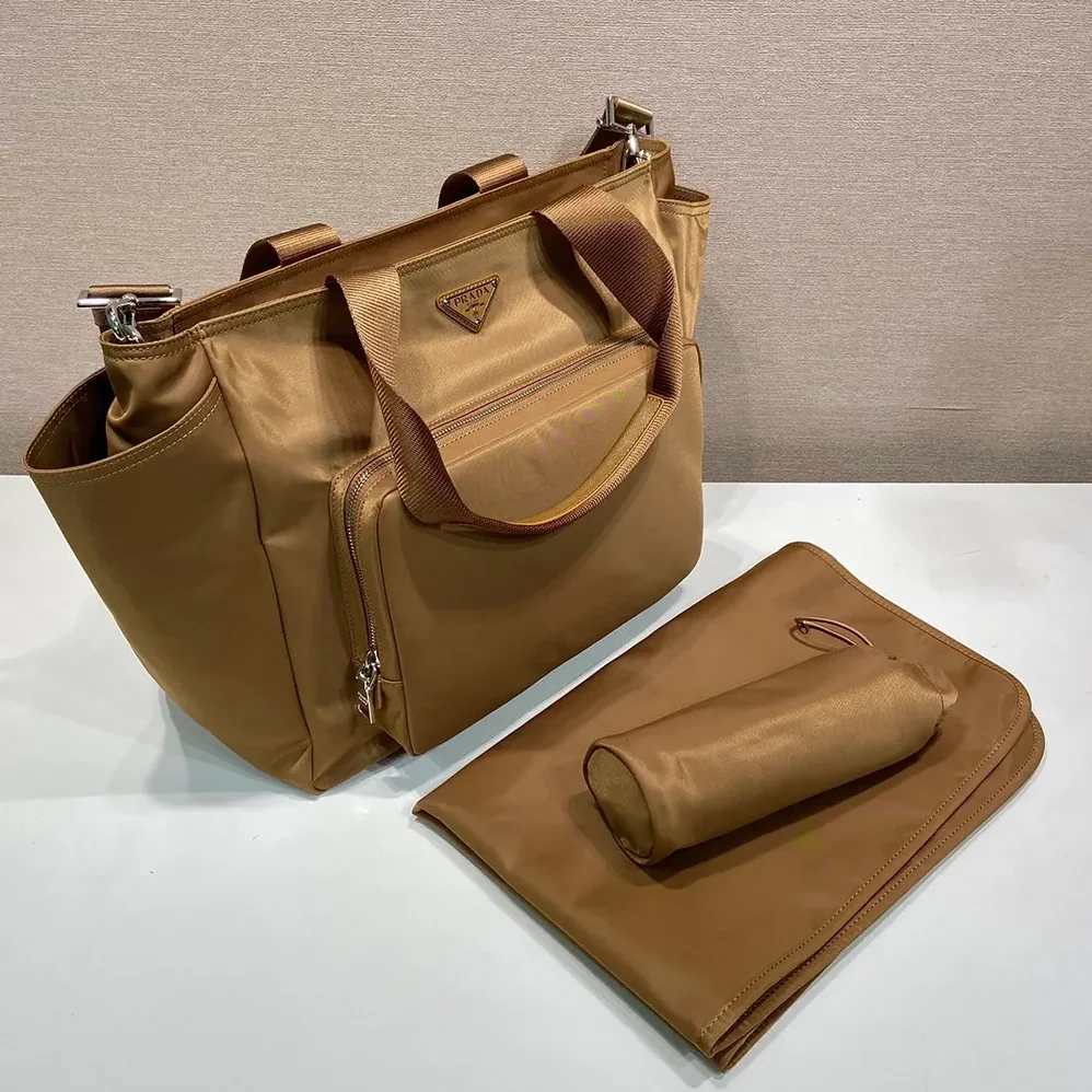 Prada Re-Nylon Baby Bag with Triangle Logo for Unisex in Brown Prada Re-Nylon Baby Bag with Triangle Logo for Unisex in Brown