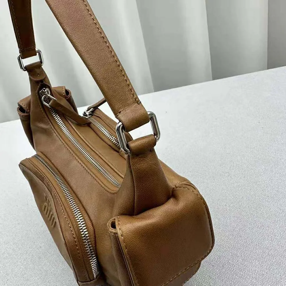 Miu Miu Pocket Nappa Leather Bag with Embossed Lettering Logo for Women in Brown Miu Miu Pocket Nappa Leather Bag with Embossed Lettering Logo for Women in Brown