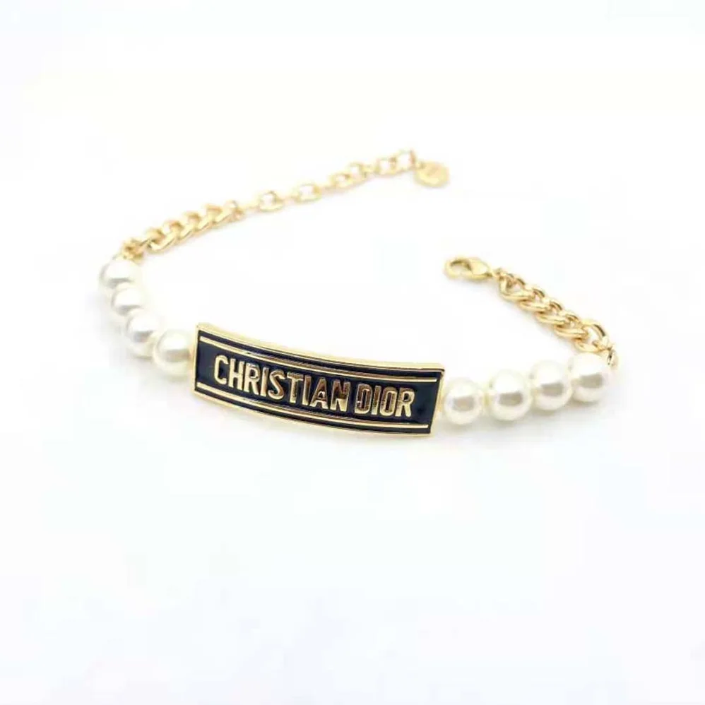 Dior Dior-id Bracelet Gold-Finish Metal with White Resin Pearls and Black Lacquer for Women Dior Dior-id Bracelet Gold-Finish Metal with White Resin Pearls and Black Lacquer for Women
