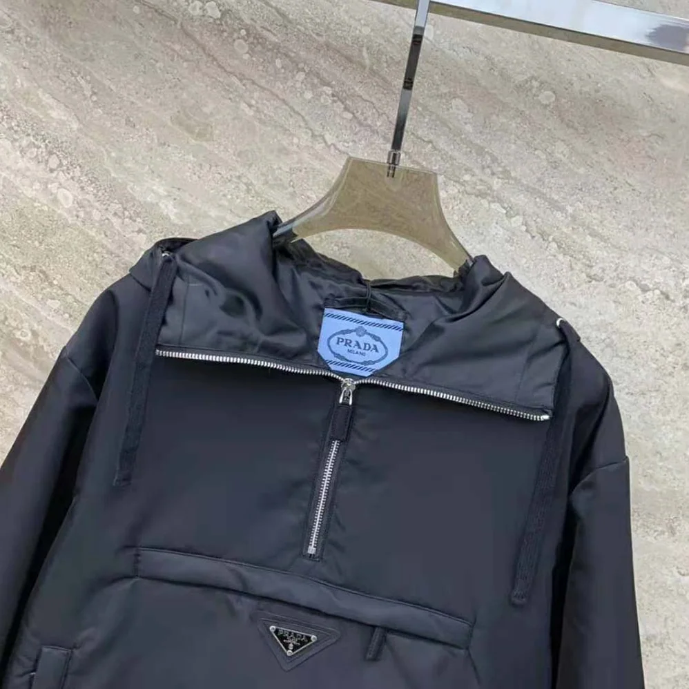 Prada Re-Nylon Blouson Jacket with Enameled Metal Triangle Logo for Women in Black Prada Re-Nylon Blouson Jacket with Enameled Metal Triangle Logo for Women in Black