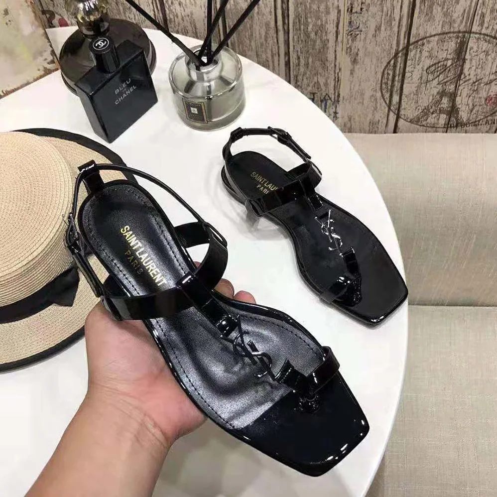 Saint Laurent YSL Cassandra Flat Sandals in Patent Leather with Silver for Women in Tone Monogram