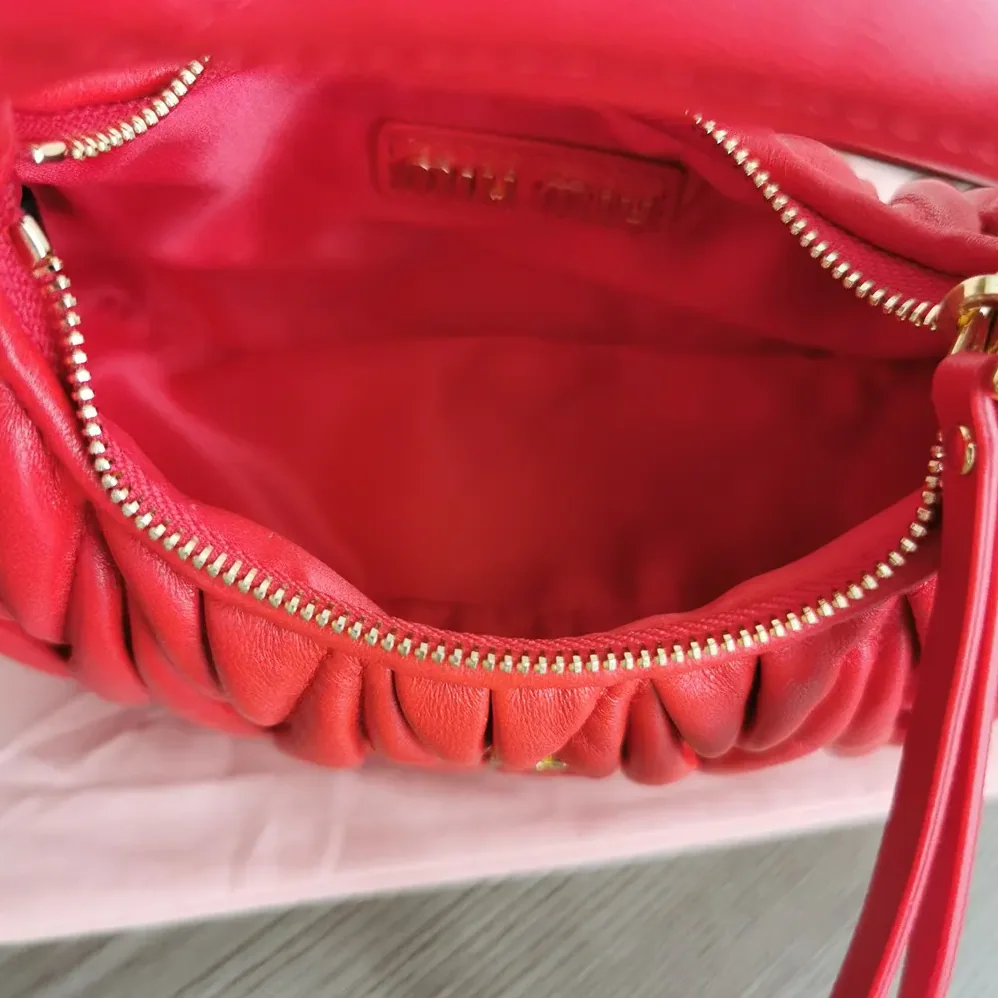 Miu Miu Wander Matelassé Nappa Leather Hobo Mini-Bag for Women in Red Miu Miu Wander Matelassé Nappa Leather Hobo Mini-Bag for Women in Red