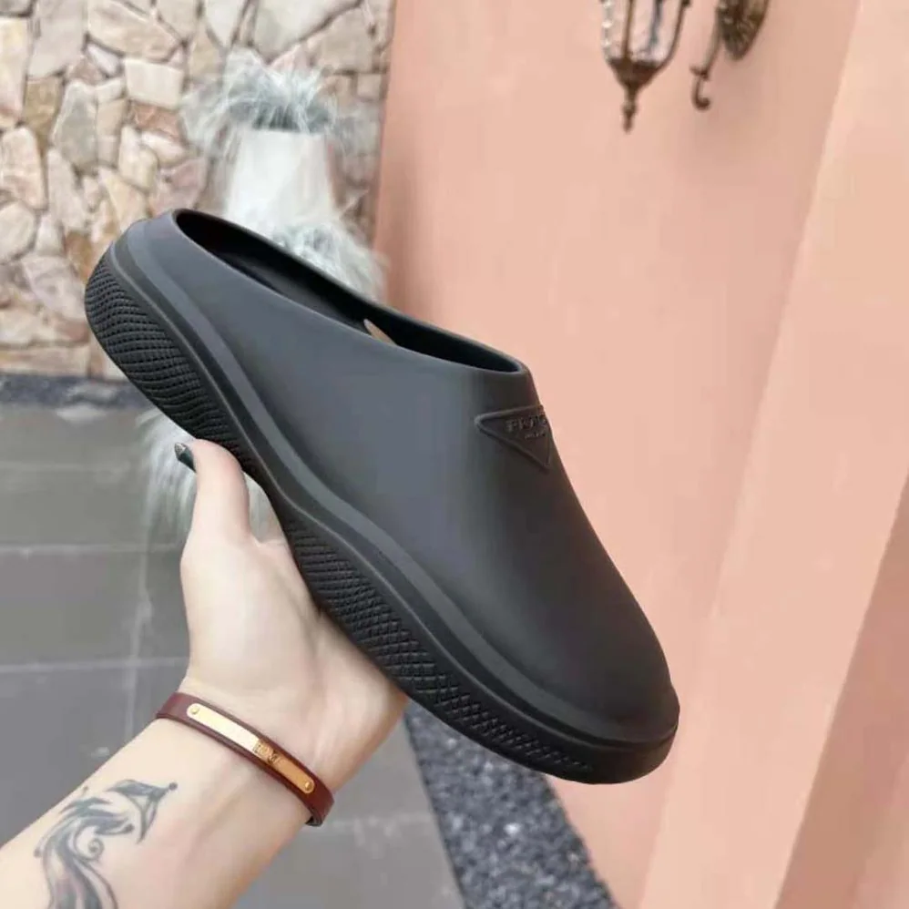 Prada Foam Rubber Mules With Embossed Rubber Triangle Logo for Women in Black Prada Foam Rubber Mules With Embossed Rubber Triangle Logo for Women in Black