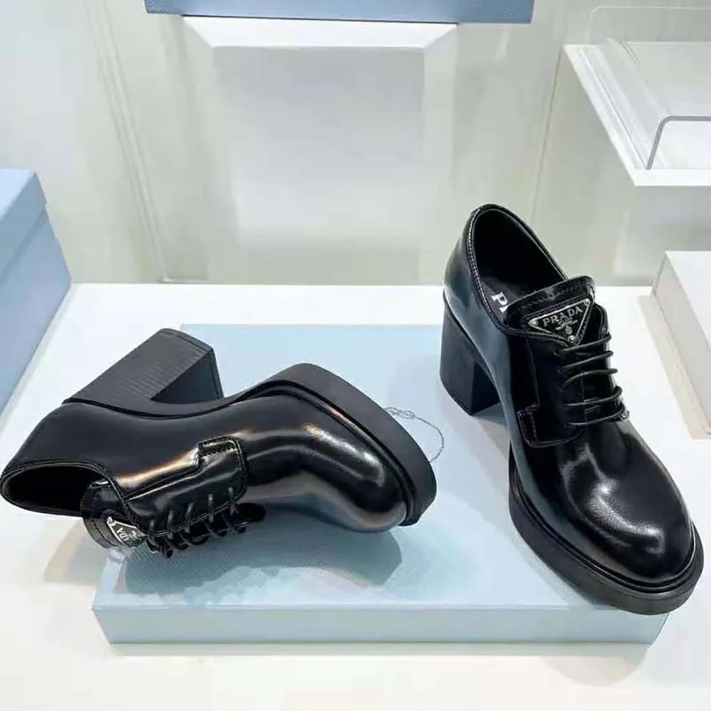 Prada Heeled Brushed Leather Lace-Ups for Women in Black Prada Heeled Brushed Leather Lace-Ups for Women in Black