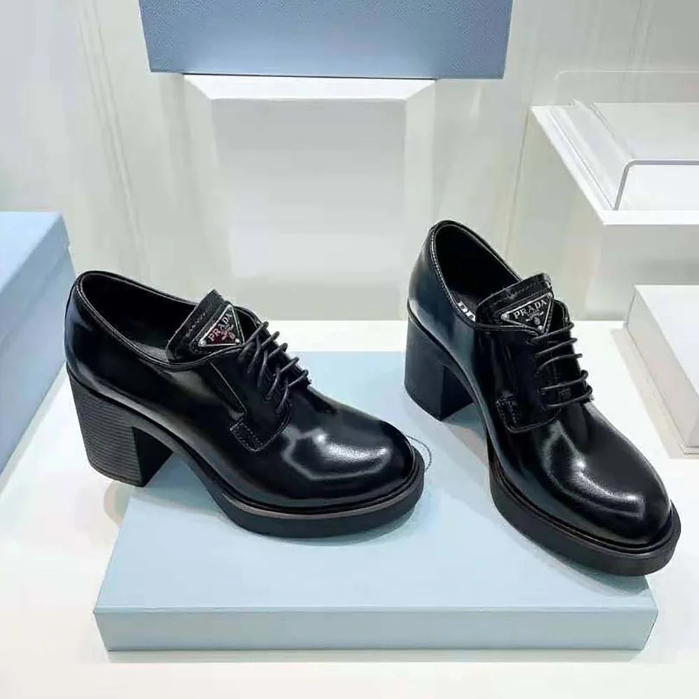 Prada Heeled Brushed Leather Lace-Ups for Women in Black Prada Heeled Brushed Leather Lace-Ups for Women in Black