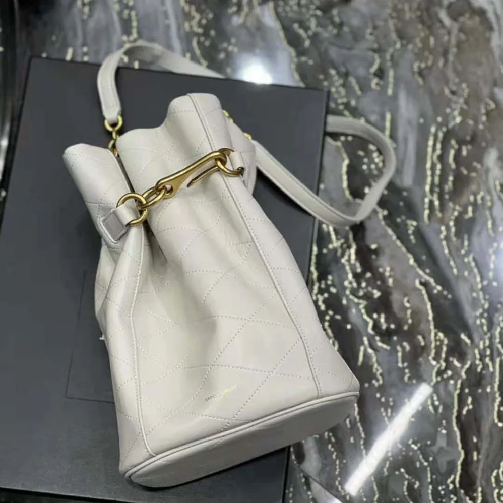 Saint Laurent YSL Le Maillon Hook Bucket Bag in Supple Leather for Women in White Saint Laurent YSL Le Maillon Hook Bucket Bag in Supple Leather for Women in White
