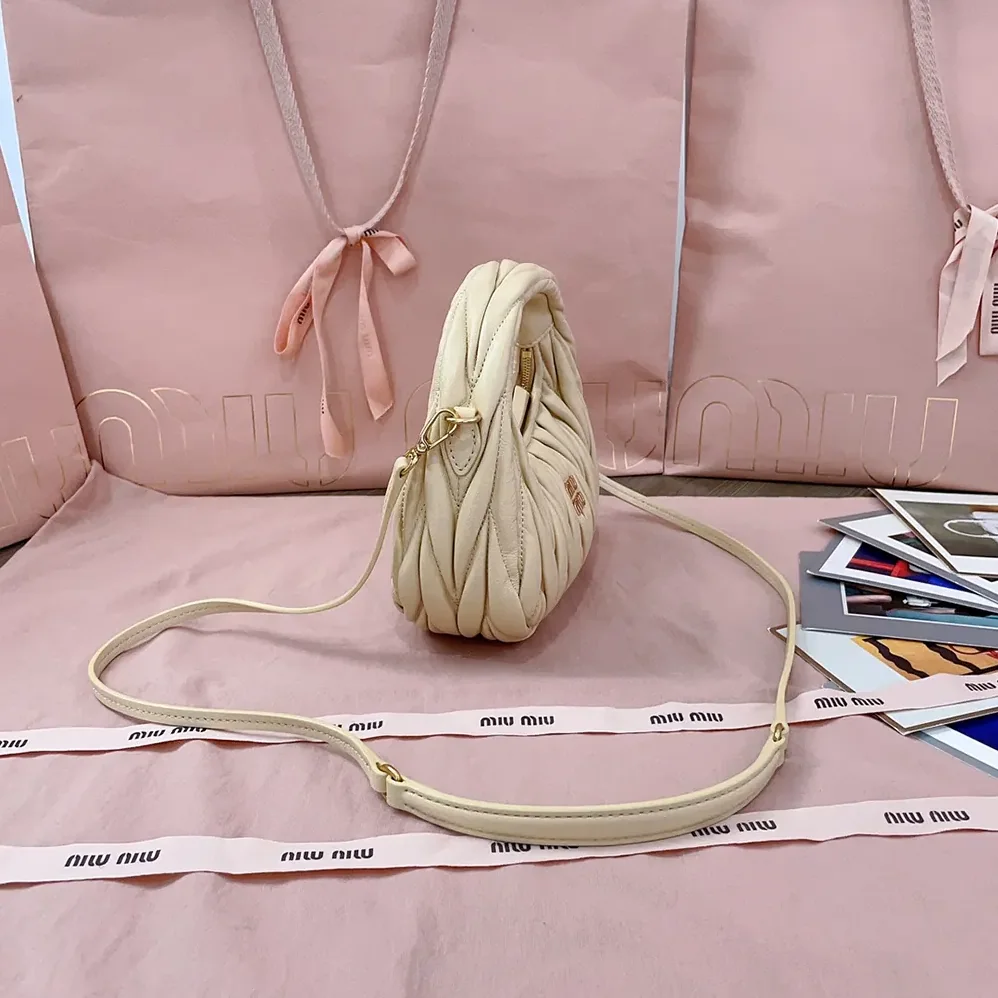 Miu Miu Wander Matelassé Nappa Leather Hobo Mini-Bag for Women in Light Yellow Miu Miu Wander Matelassé Nappa Leather Hobo Mini-Bag for Women in Light Yellow