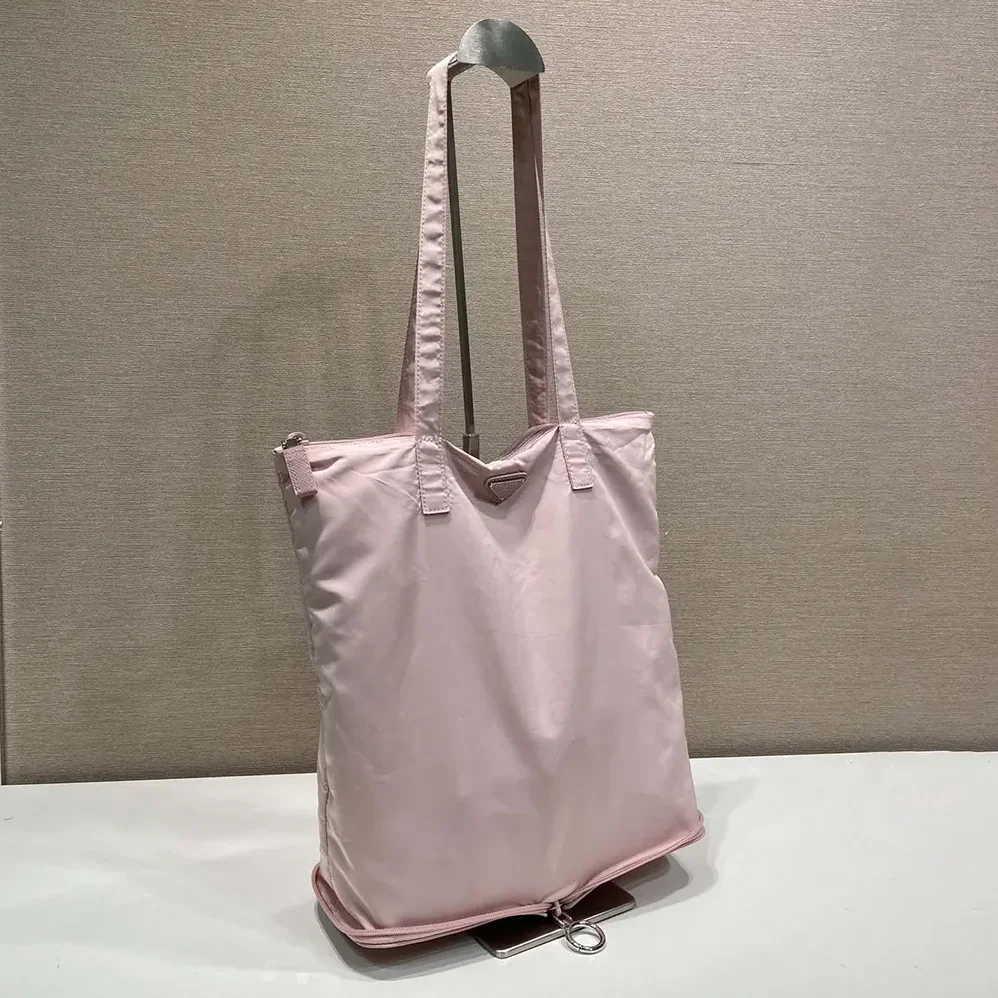 Prada Saffiano Leather Pendant With Re-Nylon Tote Bag for Women in Peach Prada Saffiano Leather Pendant With Re-Nylon Tote Bag for Women in Peach