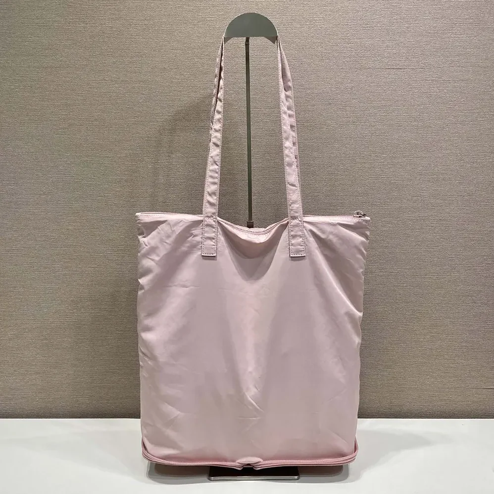 Prada Saffiano Leather Pendant With Re-Nylon Tote Bag for Women in Peach Prada Saffiano Leather Pendant With Re-Nylon Tote Bag for Women in Peach