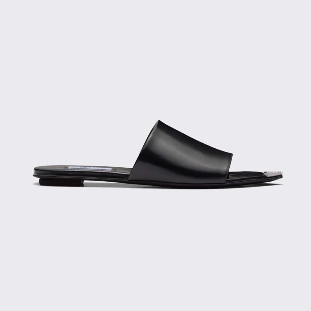Prada Brushed Leather Slides with a Modernist Line Feature an Unexpected for Women
