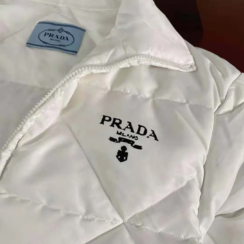 Prada Re-Nylon Gabardine Cropped Down Jacket for Women in White Prada Re-Nylon Gabardine Cropped Down Jacket for Women in White