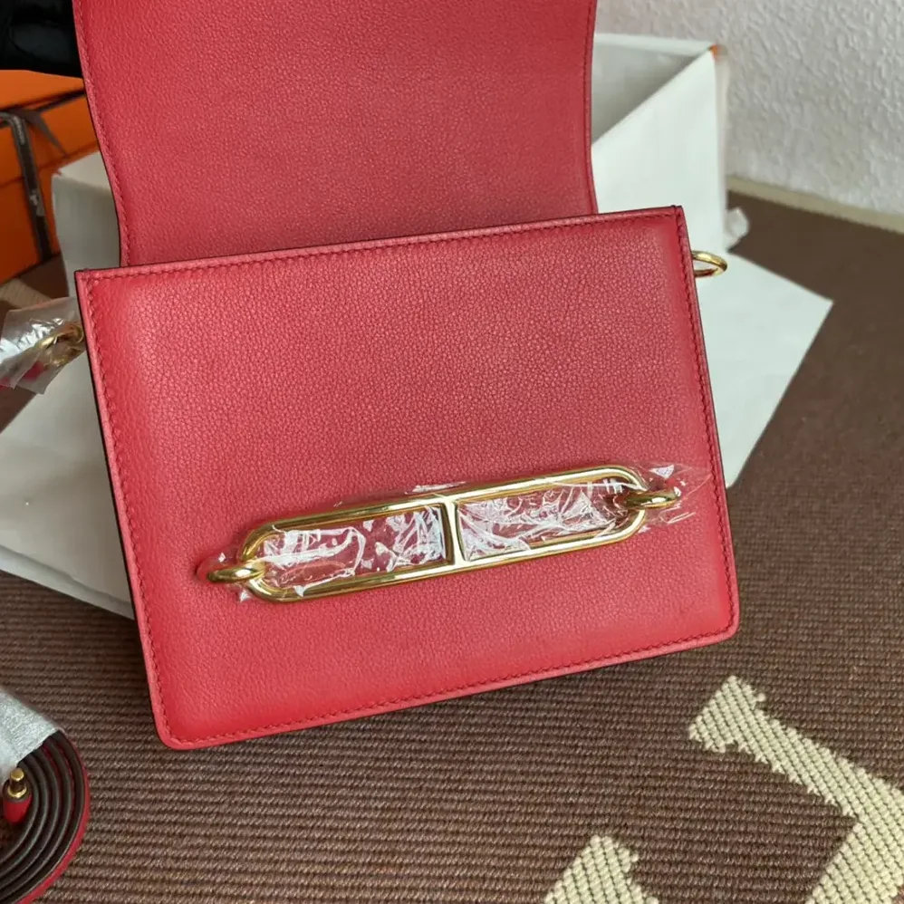Hermes Roulis Mini Bag in Evercolor Calfskin for Women in Red/Gold