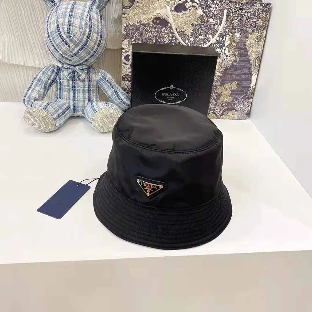 Prada Nylon Bucket Hat Decorated with the Triangle Logo for Women in Black Prada Nylon Bucket Hat Decorated with the Triangle Logo for Women in Black