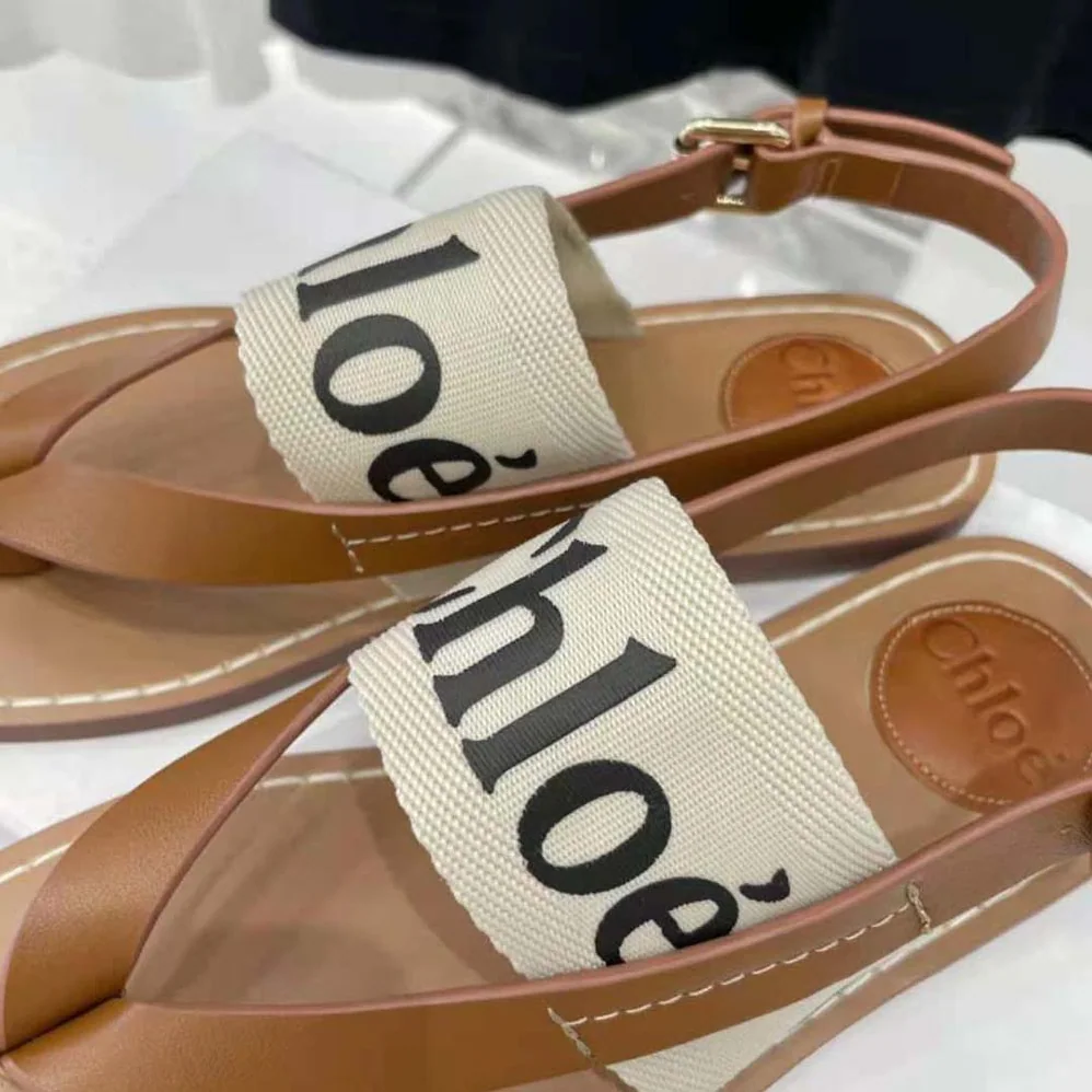 Chloe Woody Flat Sandal in Calfskin and Canvas for Women in White Chloe Woody Flat Sandal in Calfskin and Canvas for Women in White
