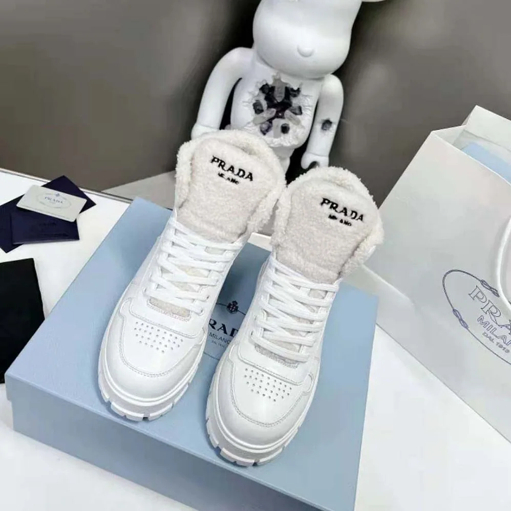 Prada Leather and Shearling High-Top Sneakers for Women in White Prada Leather and Shearling High-Top Sneakers for Women in White